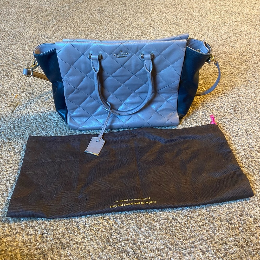 Well loved black and tan Kate spade purse.